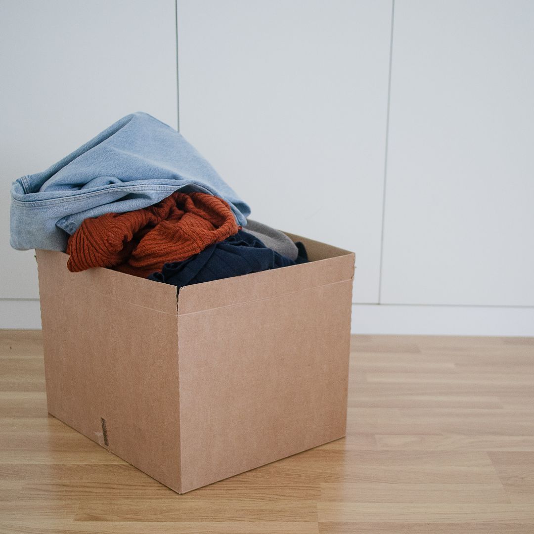 cardboard box with clothing